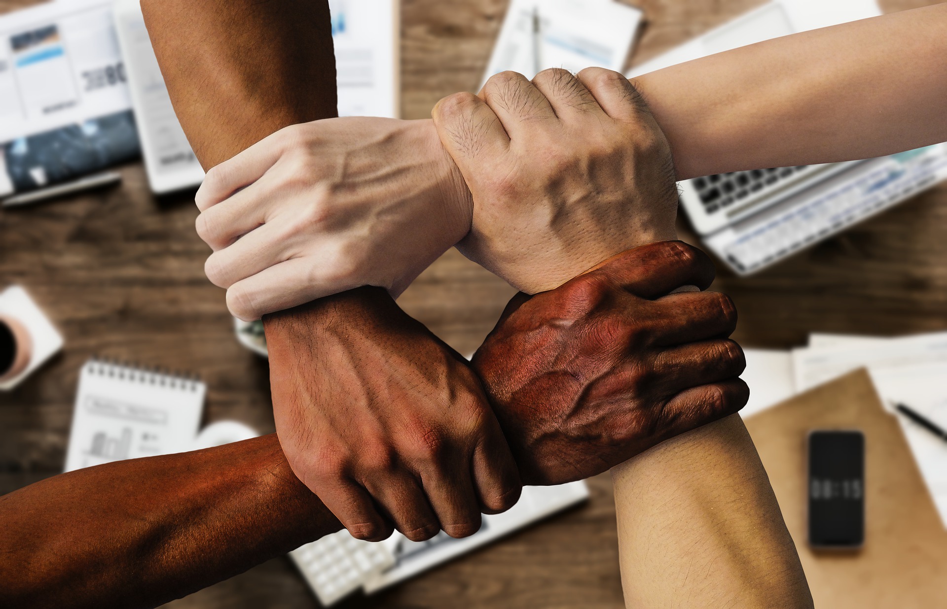 Diverse hands coming together