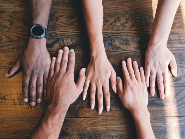 Diversity & Inclusion - Group with outstretched hands